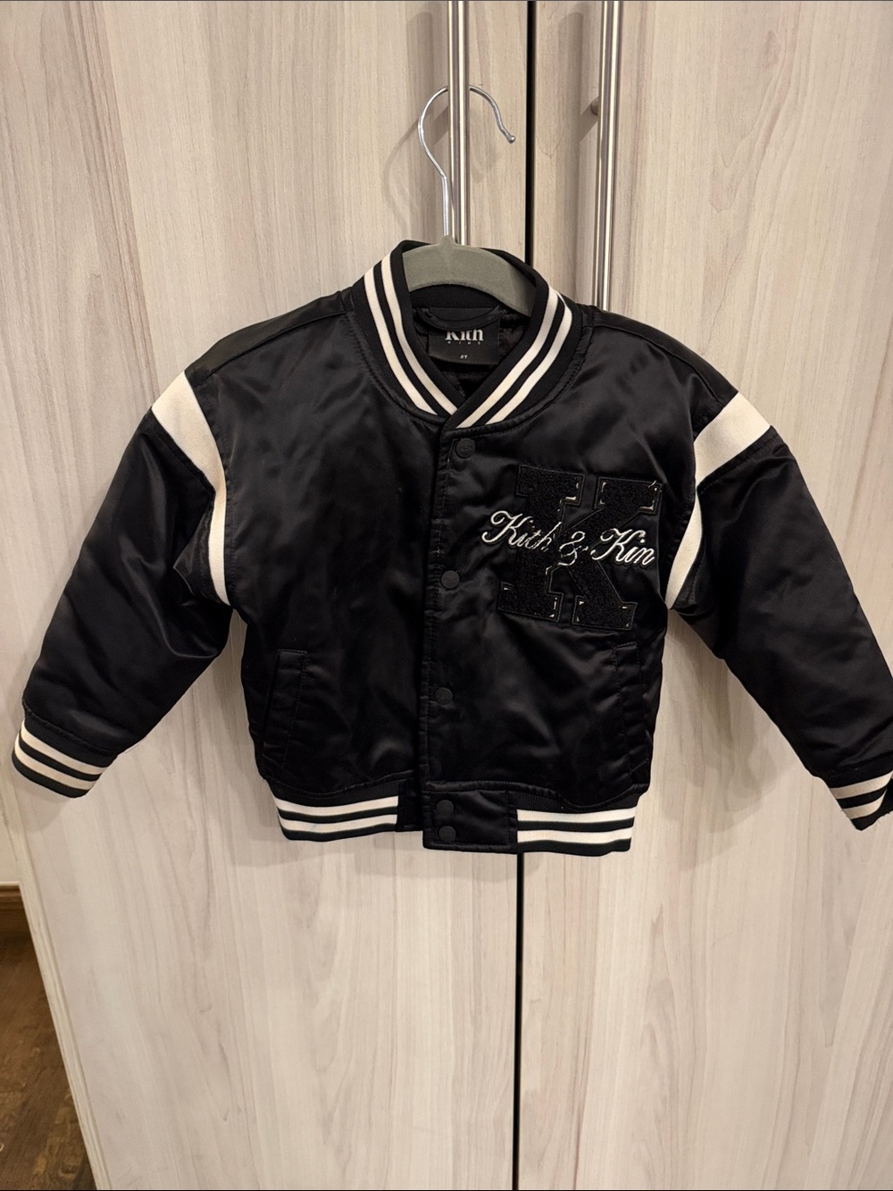 Kith Black Satin Kids' Letterman Jacket with White Stripes